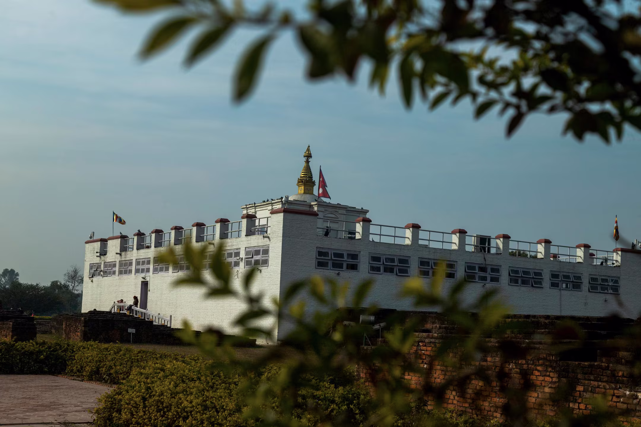 The Maya Devi Temple at Lumbini, birthplace of the Buddha, reflecting in the sacred pond