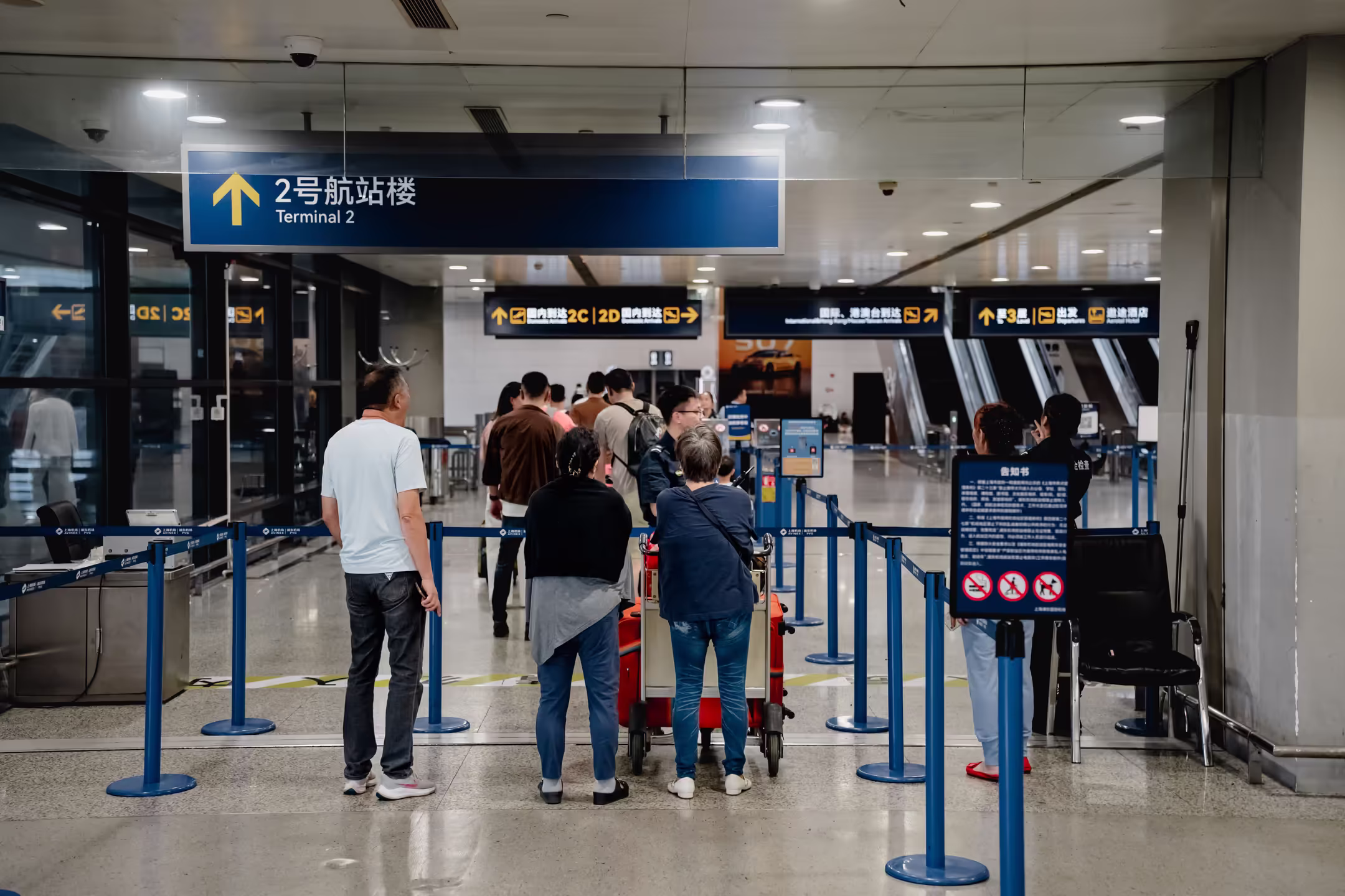 Travelers standing in an airport ready for boarding